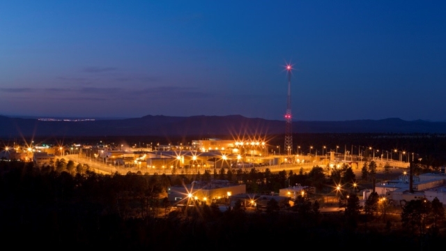 A night view of the Technical Area 55 complex at Los Alamos National Laboratory where plutonium pits for the nation’s nuclear deterrent and other important national security work is performed.  Lights in the mountain are from the city of Española, New Mexico.