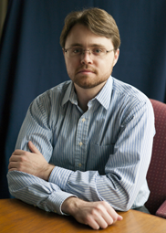 Image of Ben Caleca sitting at a table