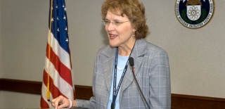 Image of a woman standing behind a podium and speaking at the 2010 Victor Stello Junior award presentation